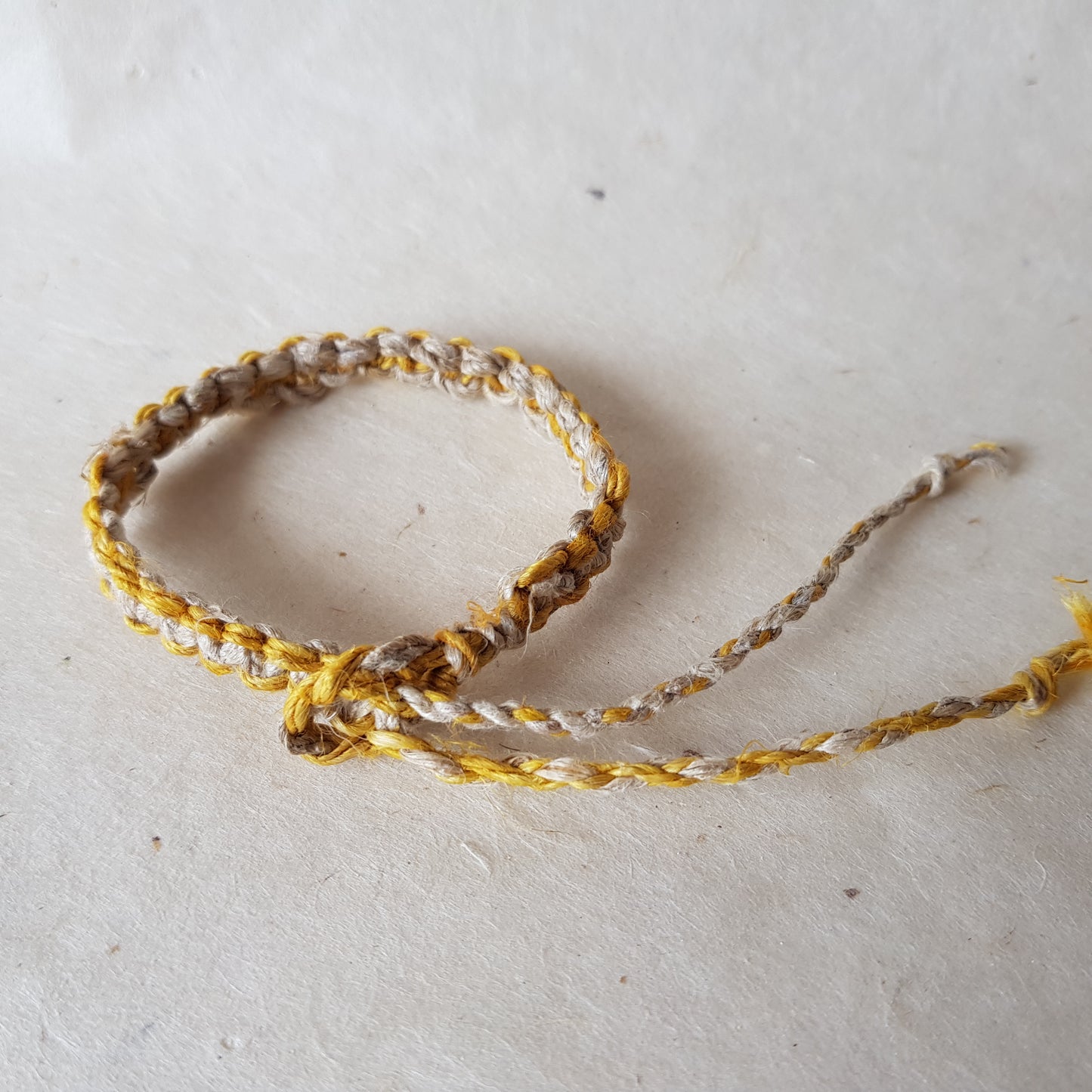 Handmade Braided Hemp Bracelet; Pack of Two, Natural and Yellow.
