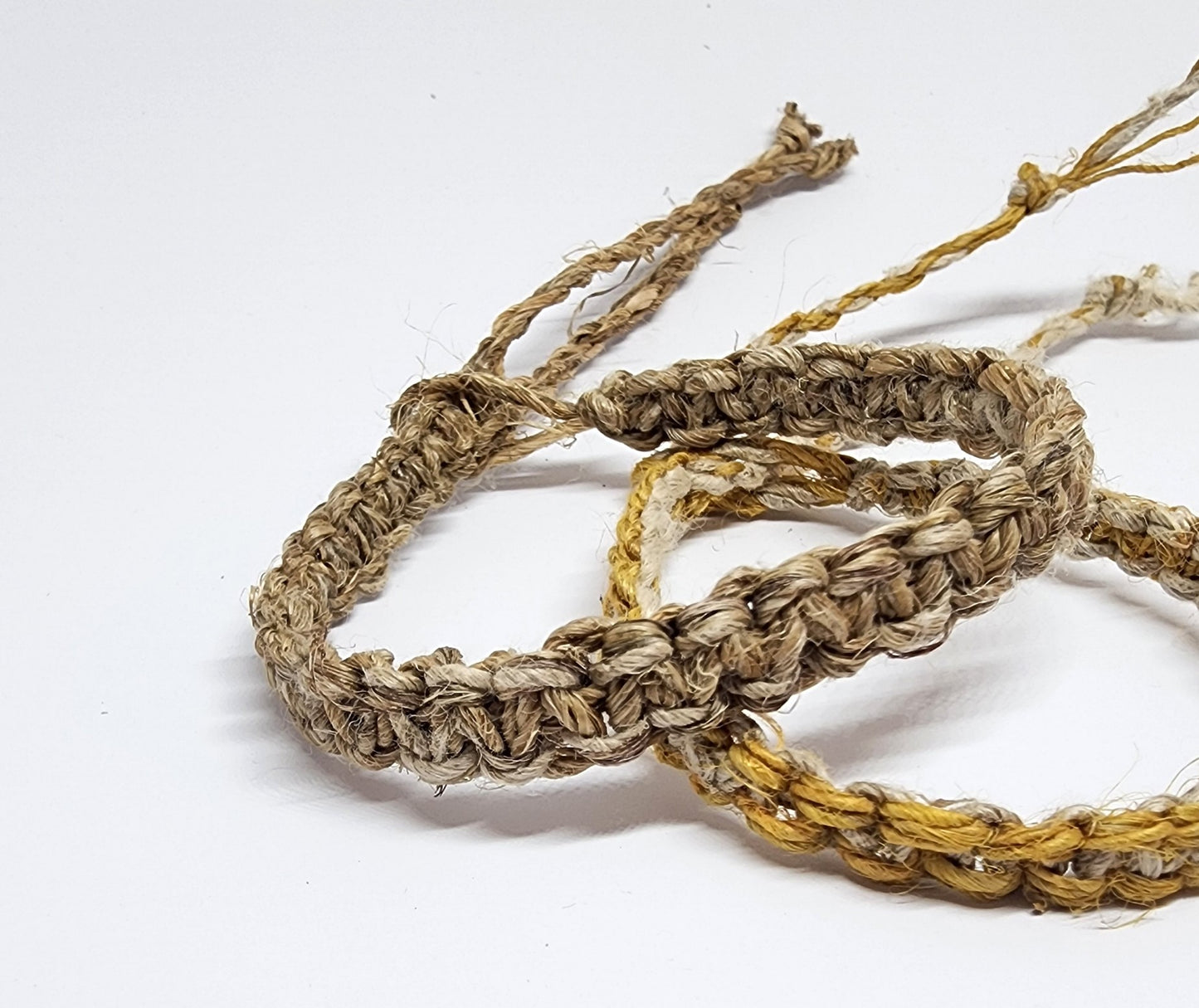 Handmade Braided Hemp Bracelet; Pack of Two, Natural and Yellow.