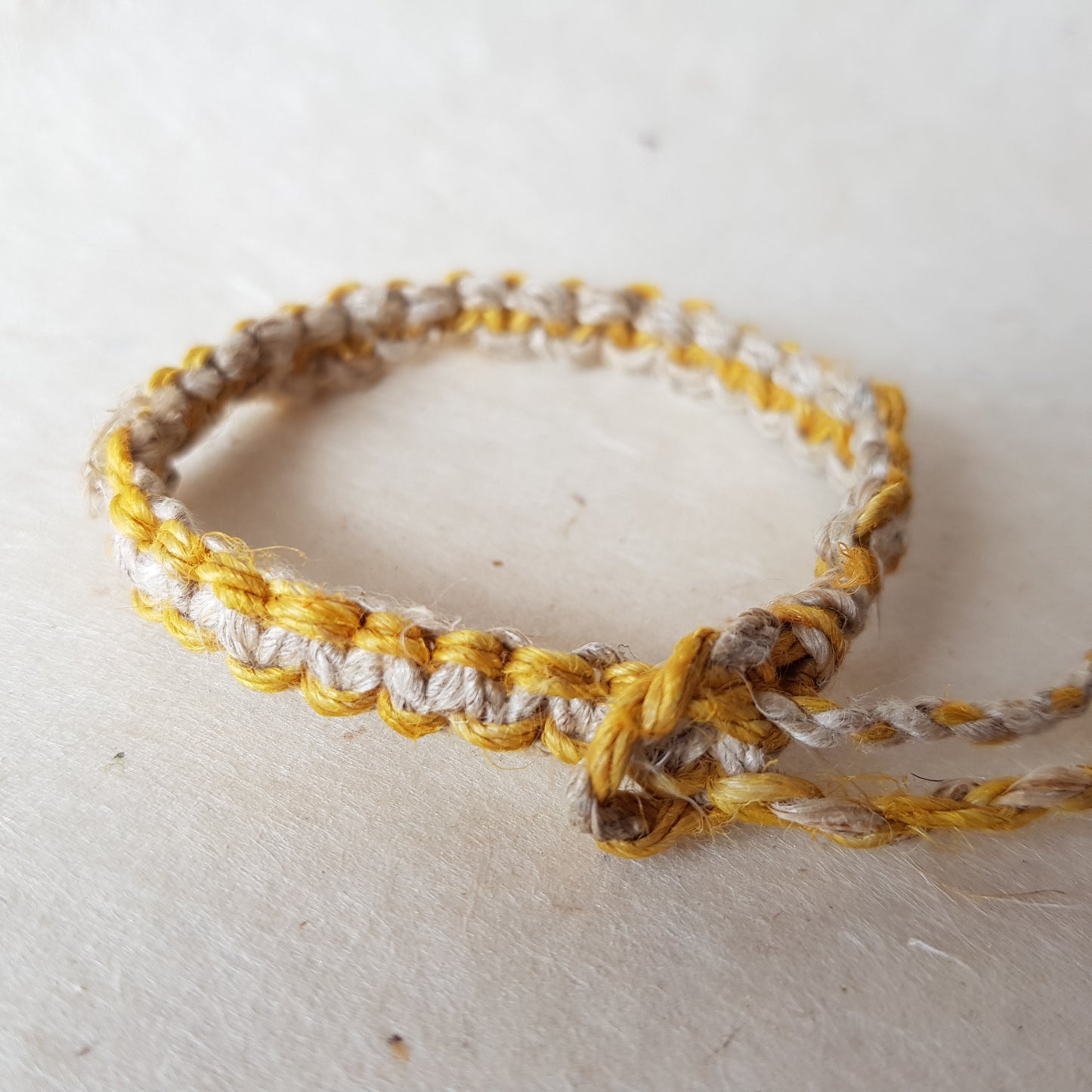 Handmade Braided Hemp Bracelet; Pack of Two, Natural and Yellow.